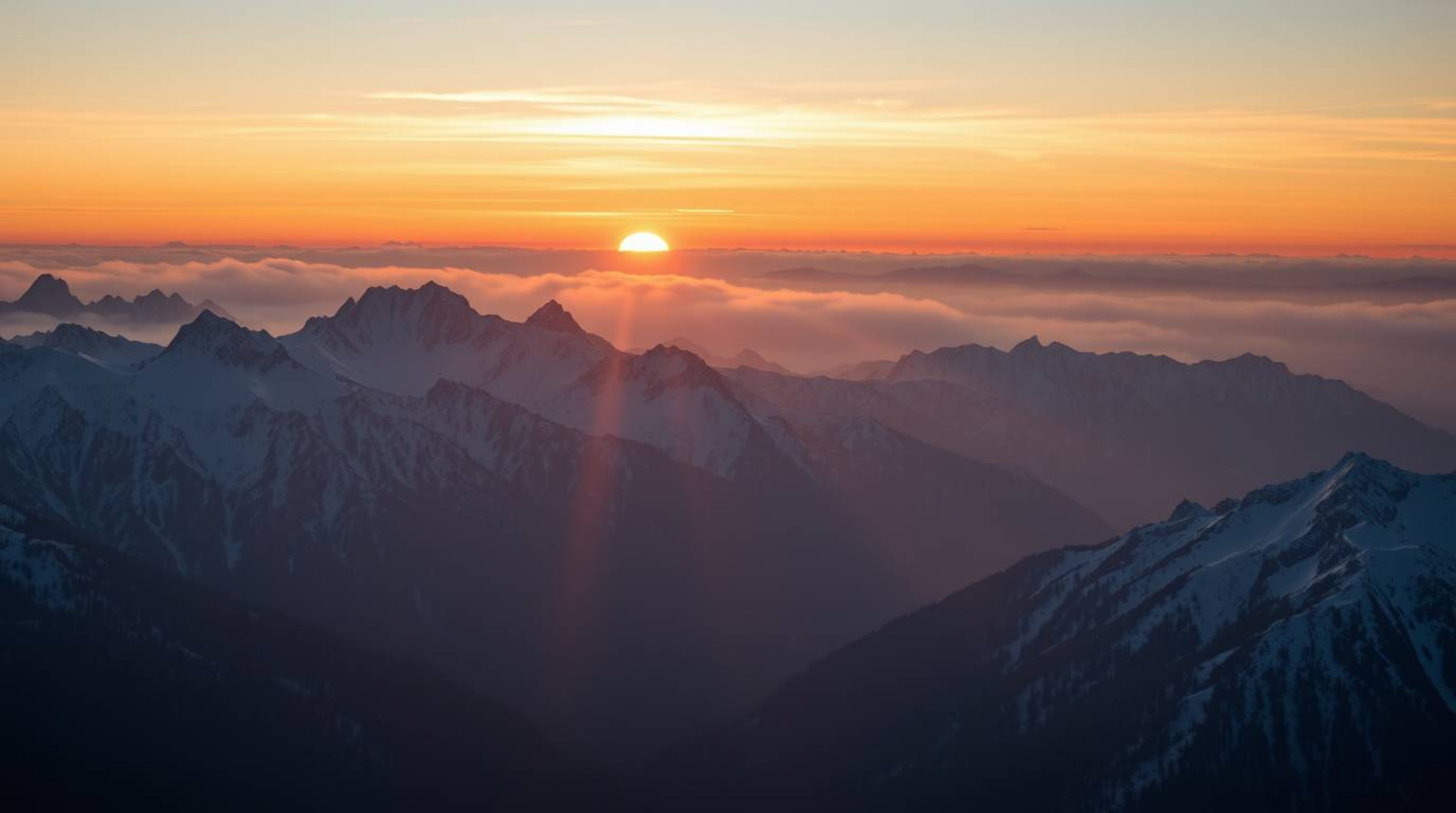 Stunning high-resolution stock photo showcasing snow-covered mountains illuminated by a soft pastel sunset. The image feature