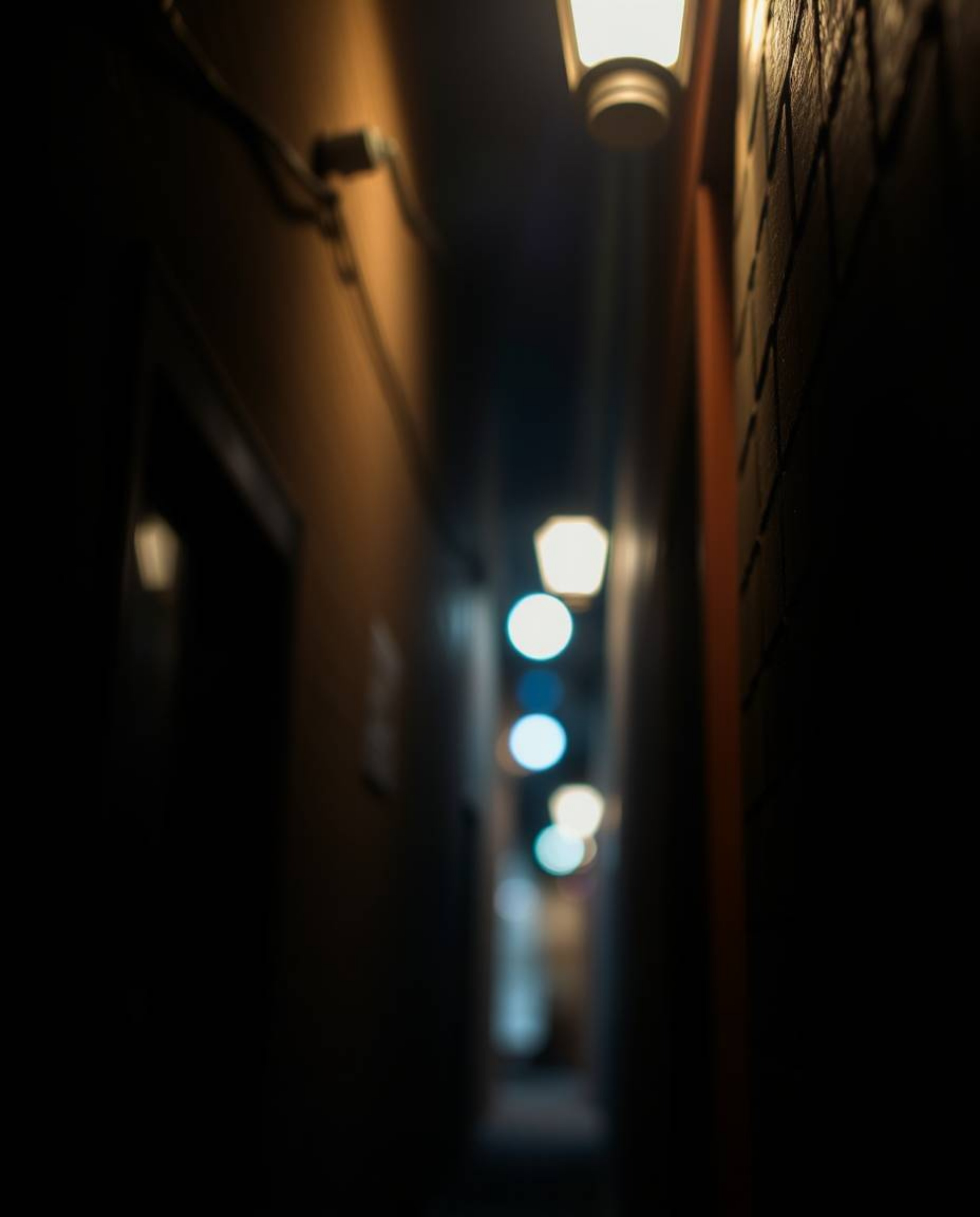 Capture the mystery of the night with this high-resolution stock photo showcasing a pair of elegant eyes peering from the sha