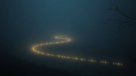 A captivating image of a river delta bathed in the eerie glow of twilight.  The scene evokes a soft, cinematic haze with dark