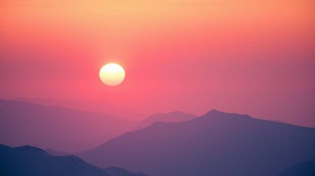 A breathtaking cinematic image showcases snow-capped mountains aglow in the soft light of a pastel sunset.  Deep ultraviolet 