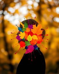 Explore captivating modern art featuring colorful splash patterns forming a human silhouette against a blurred bokeh backgrou