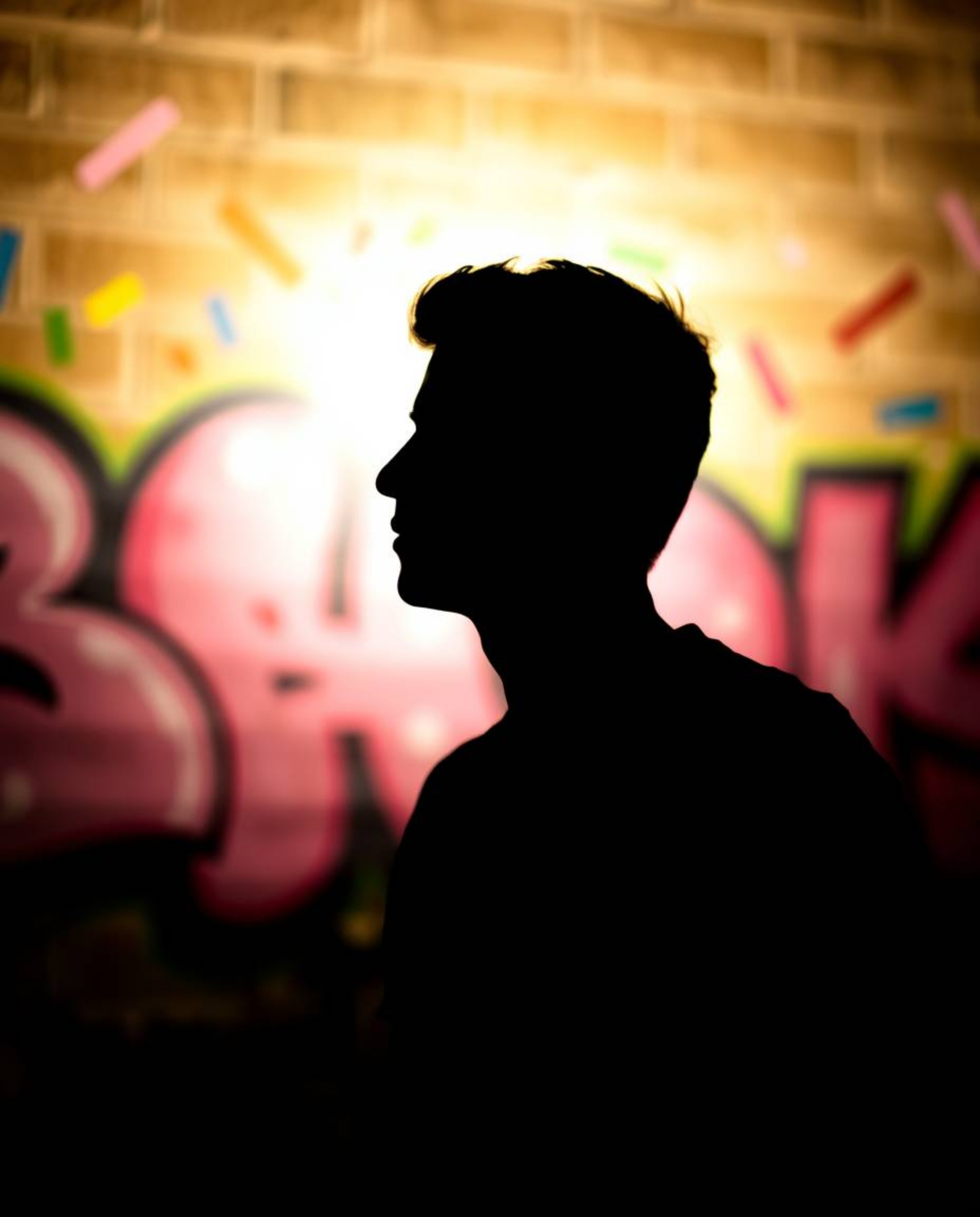 A captivating image featuring a silhouetted subject set against a beautifully blurred bokeh background, highlighting vibrant 