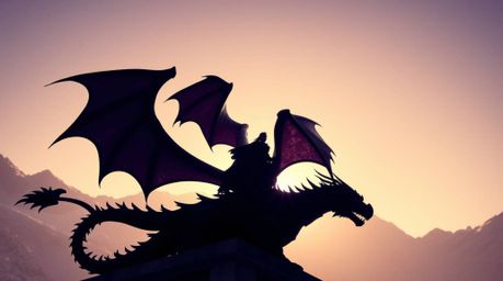 A captivating scene featuring a dragon and rider silhouetted against the backdrop of icy mountains, bathed in deep ultraviole