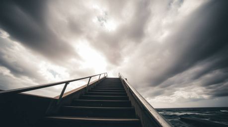 Capture the dramatic beauty of an extreme macro close-up street photograph depicting an ocean staircase ascending into a stor