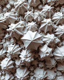 Experience a bird's-eye view of captivating sculptural clay art, showcasing intricately modeled and textured glitched geometr