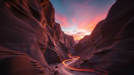 Capture the dynamism of a rocky canyon at sunset with this stunning long-exposure photograph.  Vibrant electric colors, motio