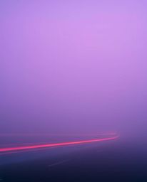 Explore the ethereal beauty of long exposure photography with images capturing thick fog, light trails, and motion blur.  The