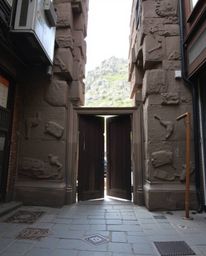 Explore captivating scenes featuring an ancient doorway etched with glowing runes on a majestic mountain, contrasted with raw