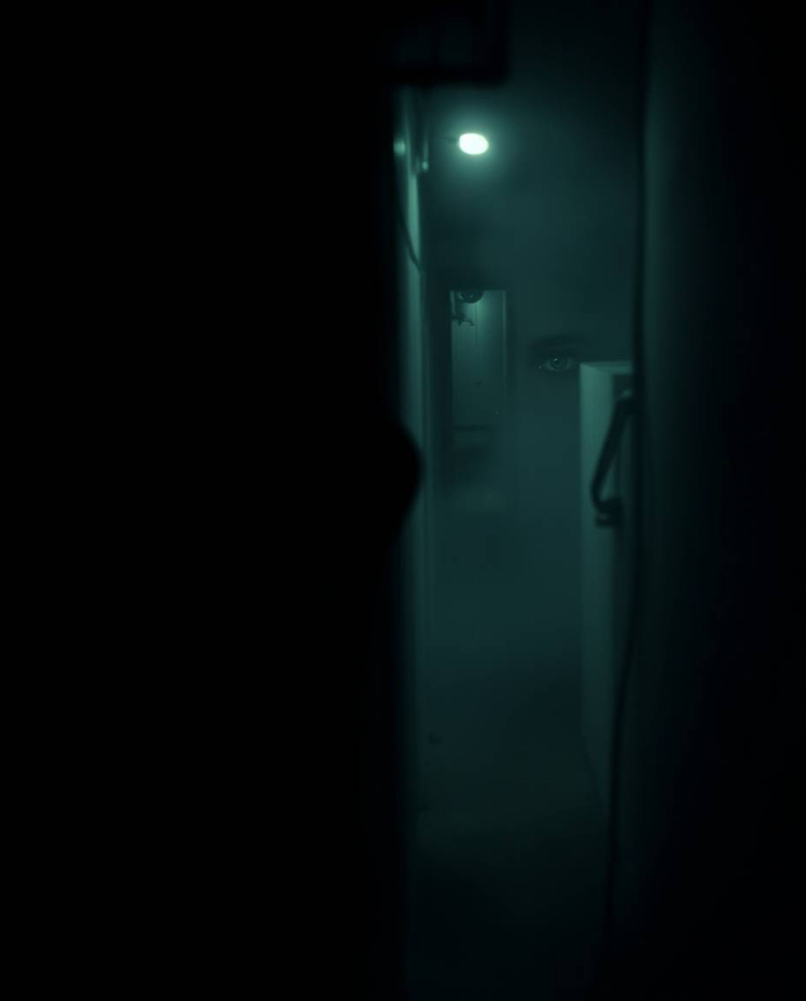 A captivating image depicting eyes watching from a shadowy alley at night, rendered with a soft cinematic haze and focus. The