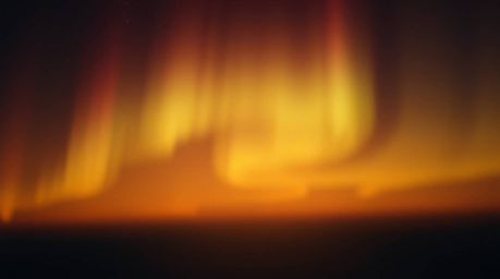 High-resolution stock photo capturing the mesmerizing beauty of warm candlelight illuminating an aurora borealis inspired gra