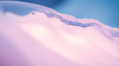 Experience the captivating beauty of a fluid abstract wave rendered in a soft pastel spectrum. This close-up shot showcases i