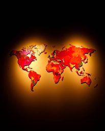 This captivating artwork presents a world map in an abstract form, composed of bright and colorful splashes. The warm contras