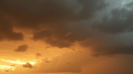 This artwork captures the dramatic beauty of volumetric lighting and natural earth tones.  Thunderstorm clouds are illuminate