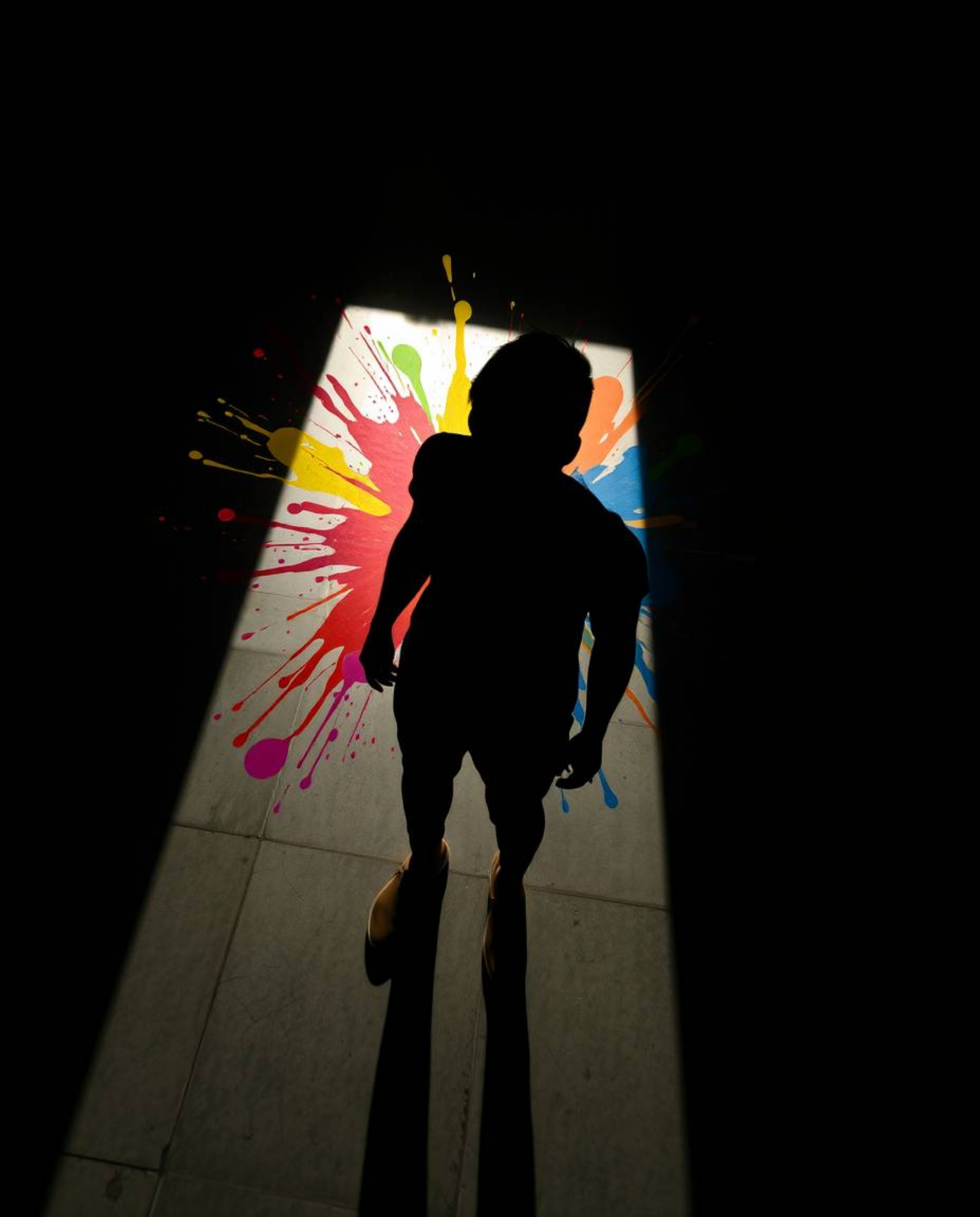Experience the dramatic impact of chiaroscuro lighting in this modern art piece.  A high-angle perspective showcases a human 