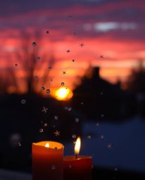 A stunning long-exposure photograph captures the elegant motion trails of snowflakes falling during a vibrant sunset. The sce