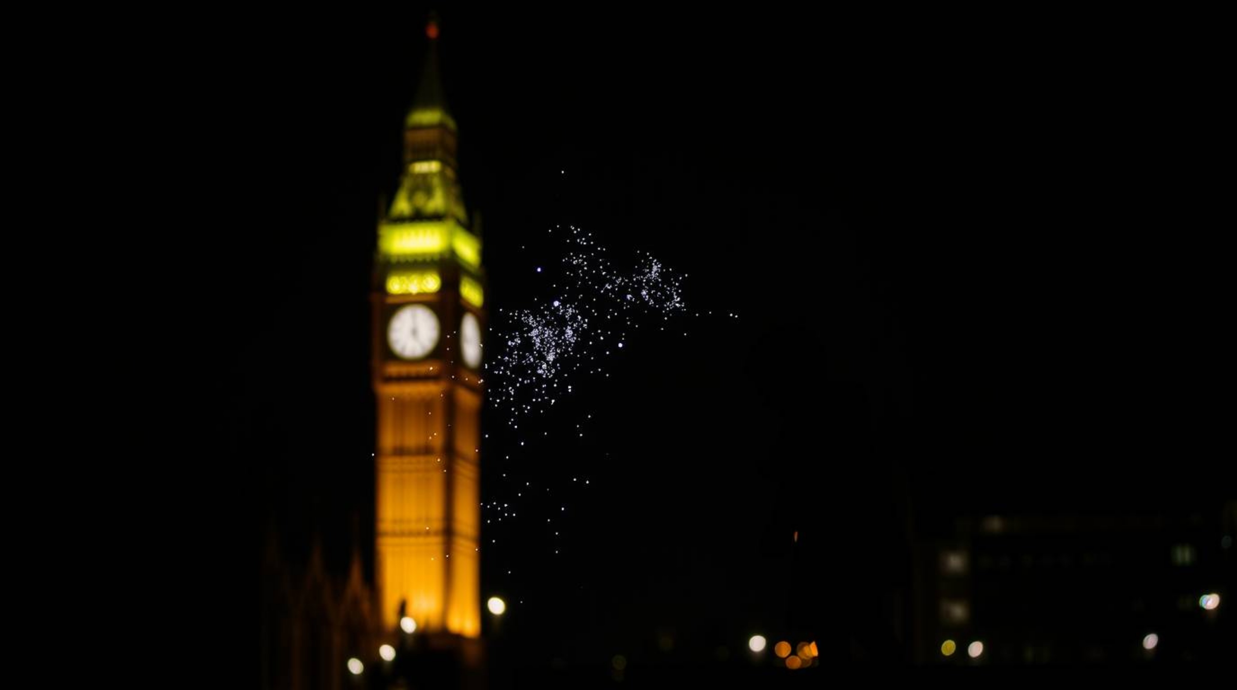 A captivating image of a young boy silhouetted against the dramatic London night sky, seemingly flying with the aid of pixie 