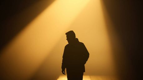 Explore the captivating world of candid street photography featuring strong, hard light that casts direct, harsh shadows and