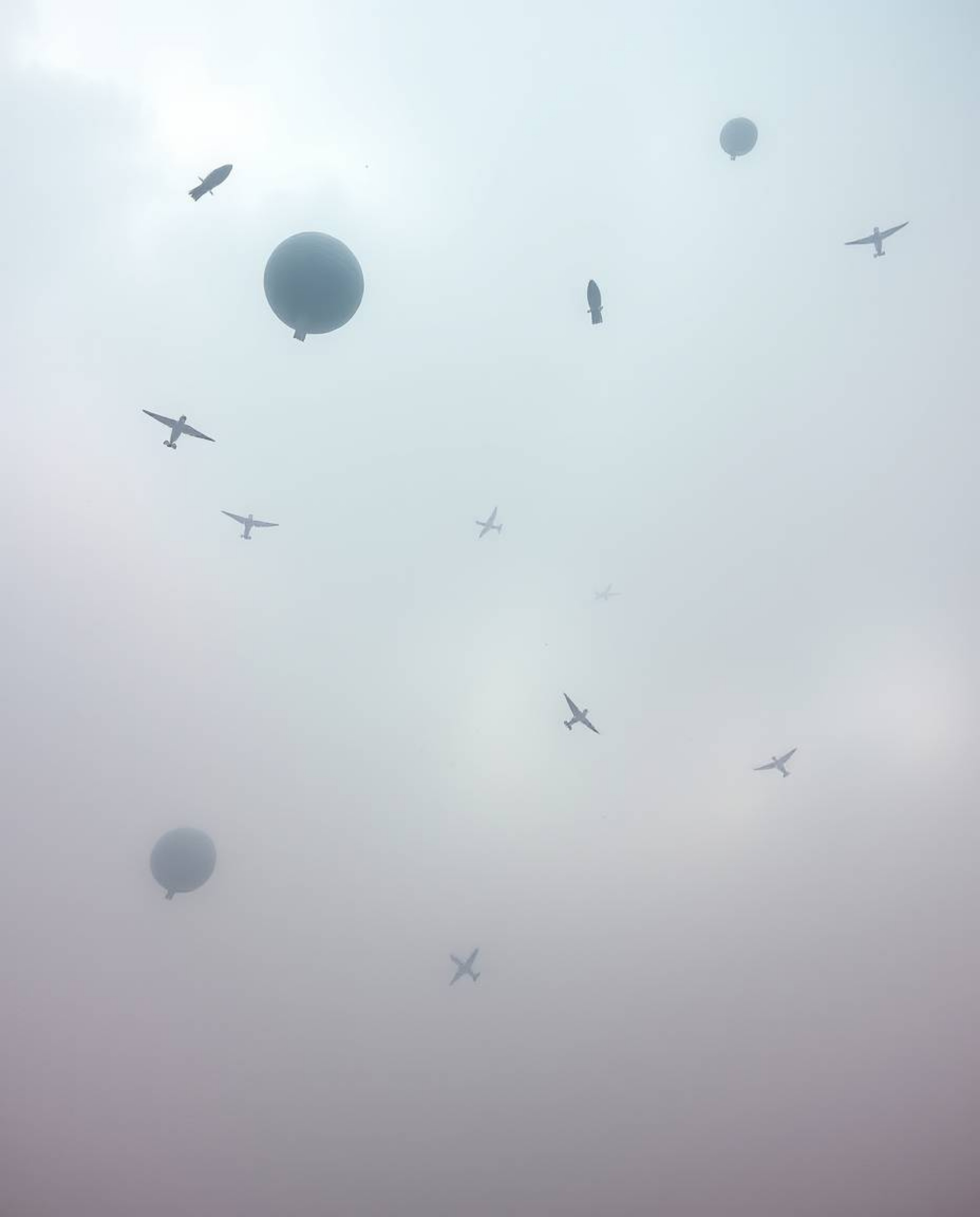 Experience a surreal storm scene featuring flying objects rendered in soft pastel colors. The low visibility and thick fog cr